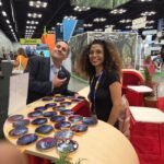 Guests enjoying personalized coasters to guests at an event.