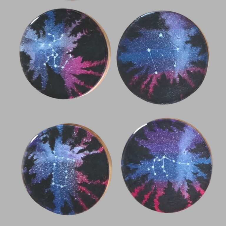 Four hand-painted coasters featuring colorful abstract radial designs